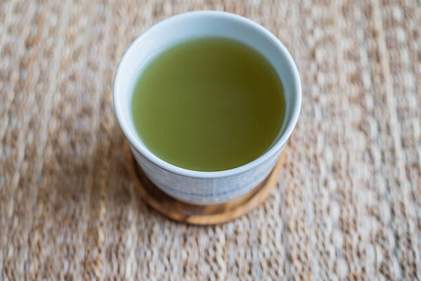 istock cup of hot green tea 487508839