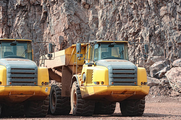 istock dumper truck in surface mine quarry 487509633