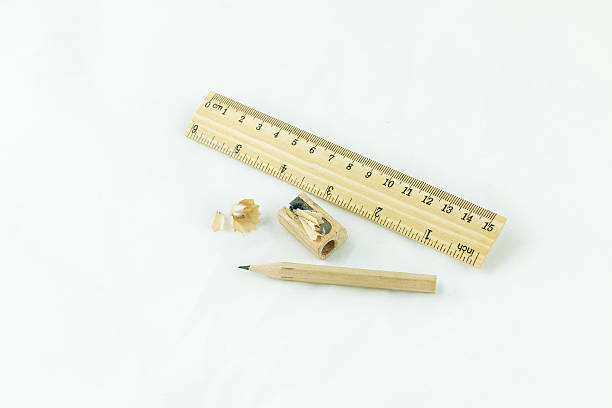 istock Wooden pencil sharpener and ruler on white background 487510343