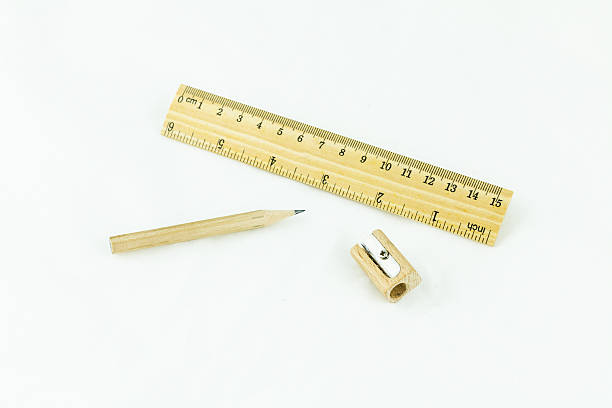 istock Wooden pencil sharpener and ruler on white background 487510713
