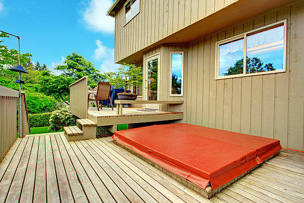 istock Backyard deck with patio area and hot tub 487511197