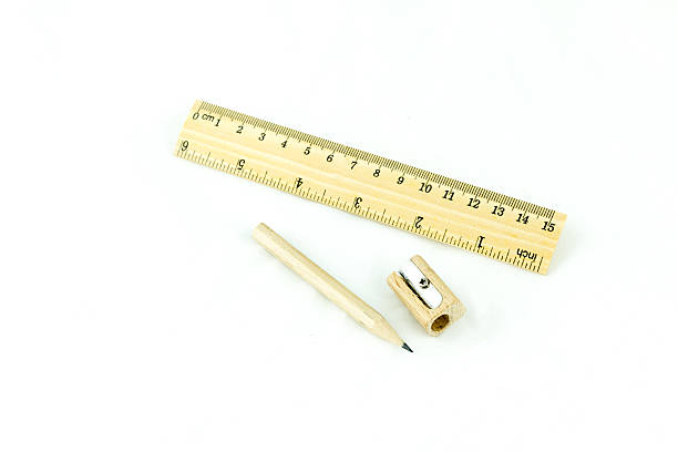 istock Wooden pencil sharpener and ruler on white background 487511401
