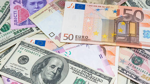 Money background Different banknotes (dollar, euro, hryvnia) make money background ukrainian currency stock pictures, royalty-free photos & images