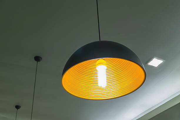 istock The modern hanging lamp on working room. 487511926