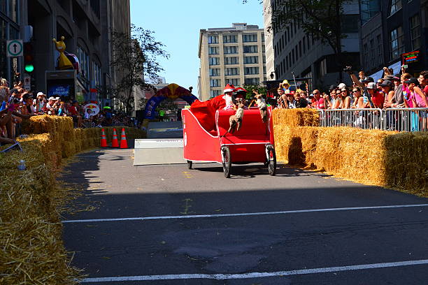 Montreal Red Bull Soapboax Race Montreal, Canada - September 06, 2015: Montreal Red Bull Soapbox Race in Montreal Downtown.A lot of fun and ingenious ideas.Number 19-Noel team. red bull mini stock pictures, royalty-free photos & images