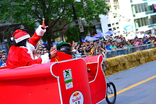 Montreal Red Bull Soapbox Race Montreal, Canada - September 06, 2015: Montreal Red Bull Soapbox Race in Montreal Downtown.A lot of fun and ingenious ideas.Number 19-Noel team. red bull mini stock pictures, royalty-free photos & images