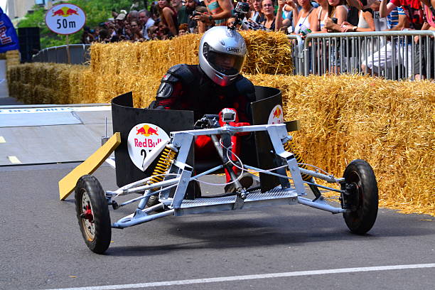 Montreal Red Bull Soapbox Race Montreal, Canada - September 06, 2015: Montreal Red Bull Soapbox Race in Montreal Downtown.A lot of fun and ingenious ideas.Number 27 team. red bull mini stock pictures, royalty-free photos & images