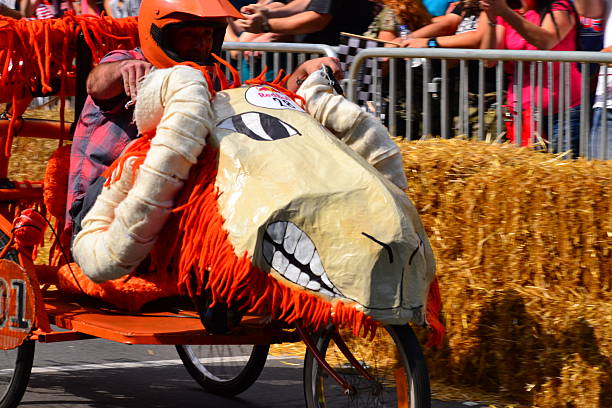 Montreal Red Bull Soapbox Race Montreal, Canada - September 06, 2015: Montreal Red Bull Soapbox Race in Montreal Downtown.A lot of fun and ingenious ideas.Number 28-Buffalo team. red bull mini stock pictures, royalty-free photos & images