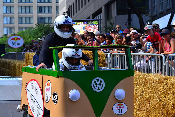 Montreal Red Bull Soapbox Race Montreal, Canada - September 06, 2015: Montreal Red Bull Soapbox Race in Montreal Downtown.A lot of fun and ingenious ideas.Number 31-VW van team. red bull mini stock pictures, royalty-free photos & images