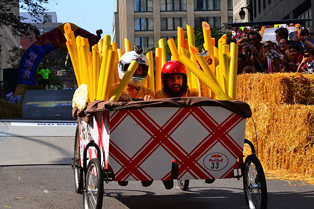 Montreal Red Bull Soapbox Race Montreal, Canada - September 06, 2015: Montreal Red Bull Soapbox Race in Montreal Downtown.A lot of fun and ingenious ideas.Number 33-Spaggethi team. red bull mini stock pictures, royalty-free photos & images