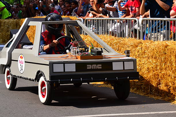 Montreal Red Bull Soapbox Race Montreal, Canada - September 06, 2015: Montreal Red Bull Soapbox Race in Montreal Downtown.A lot of fun and ingenious ideas.Number 34-Back to the Future team. red bull mini stock pictures, royalty-free photos & images