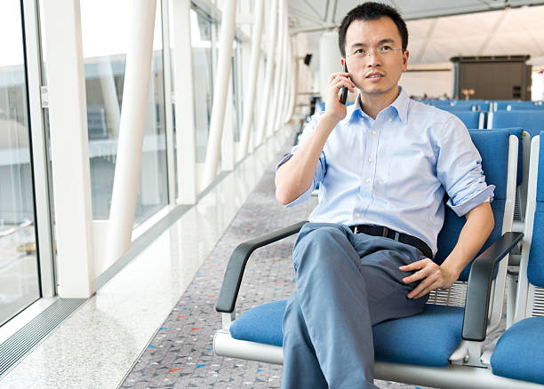 istock waiting traveller on the phone 487512503