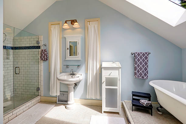 istock Velux bathroom with antique bath tub 487512775