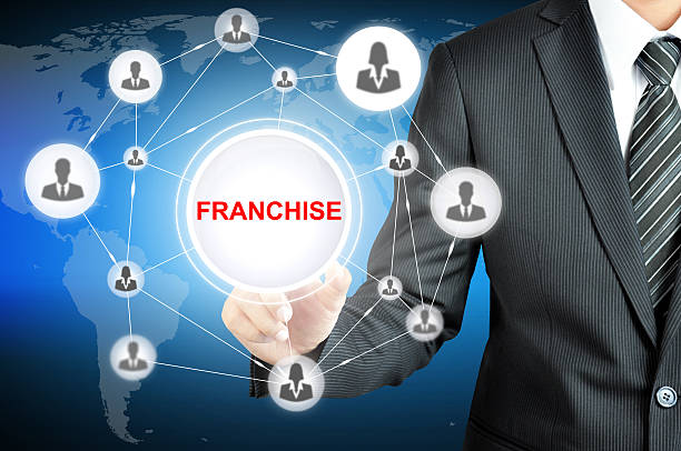 istock Businessman hand touching FRANCHISE sign on virtual screen 487514404