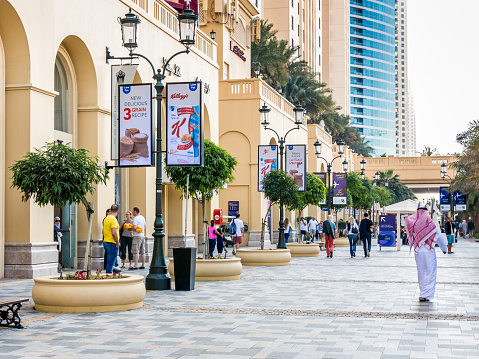 Dubai, United Arab Emirates - January 25, 2014: People hanging out on The Walk Promenade in the Marina district of Dubai