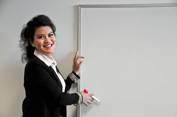 istock Business woman present with draw board on white background 487519498