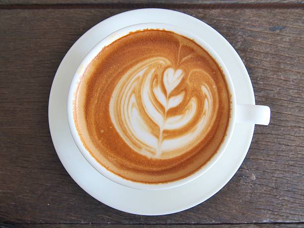 istock Latte Coffee art on the wooden desk. 487519760