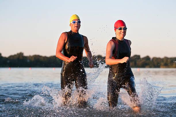 istock Triathlon Participants Running in The Water. 487520187