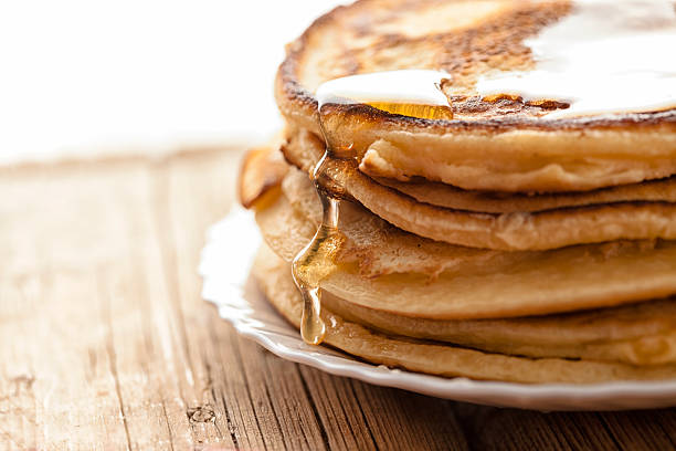 honey  and pancakes honey  and pancakes on the wooden table crêpe pancake photos stock pictures, royalty-free photos & images