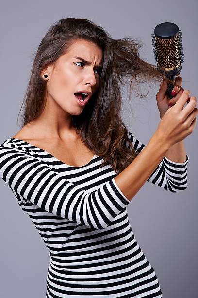 istock Very uncomfortable feeling when you can't brush your hair 487521460
