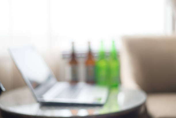 Blurred Laptop computer and beer. Blurred Laptop computer and beer. hrant dink stock pictures, royalty-free photos & images