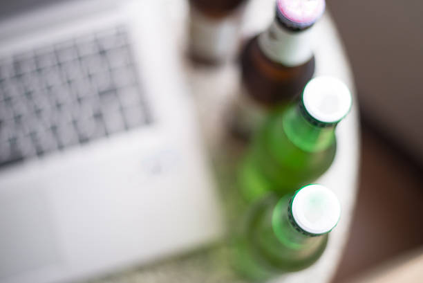 Blurred Laptop computer and beer. Blurred Laptop computer and beer. hrant dink stock pictures, royalty-free photos & images