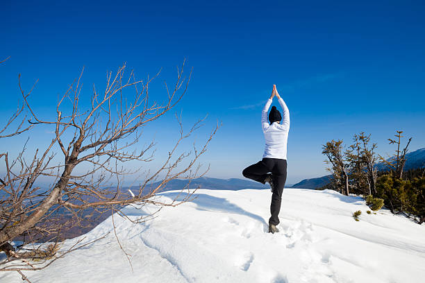 Winter yoga session in beautiful mountain place Winter yoga session in beautiful place - Beskid mountains, Poland. Babiagora National Park beskid mountains photos stock pictures, royalty-free photos & images