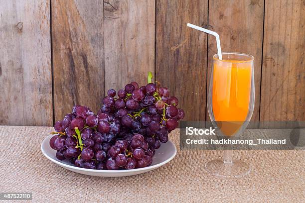 Red Grapes In Dish And Orange Juice Stock Photo - Download Image Now - 2015, Agriculture, Berry Fruit