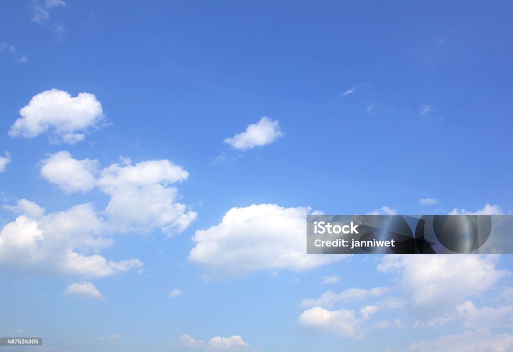 Clear blue sky with scattered clouds Clouds And Clear Blue Sky Weather Nature. Abstract Stock Photo