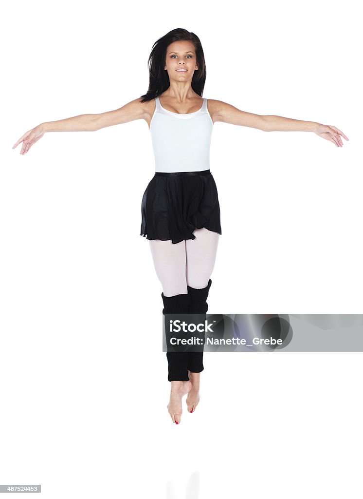 Female modern dancer Beautiful female modern jazz contemporary style dancer isolated on a white background. Dancer is wearing a blue leotard, black skirt and leg warmers. Activity Stock Photo