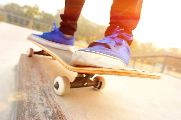 istock Legs in sneakers on a skateboard 487526427