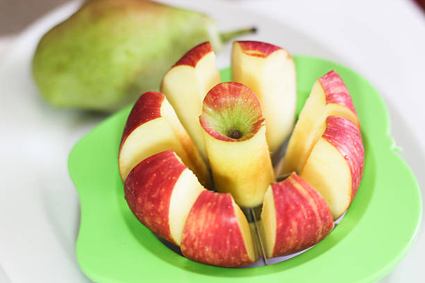 Apple cut into slices and core stock photo
