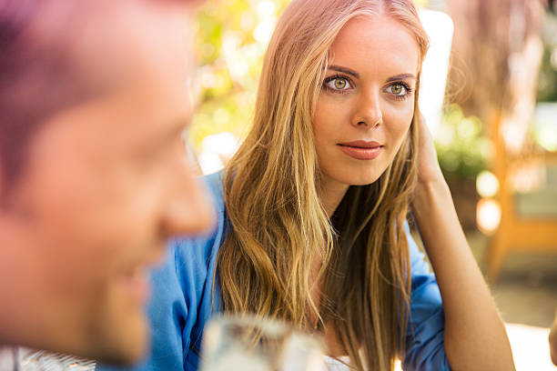 istock Woman sitting in outdoor restaurant 487527052