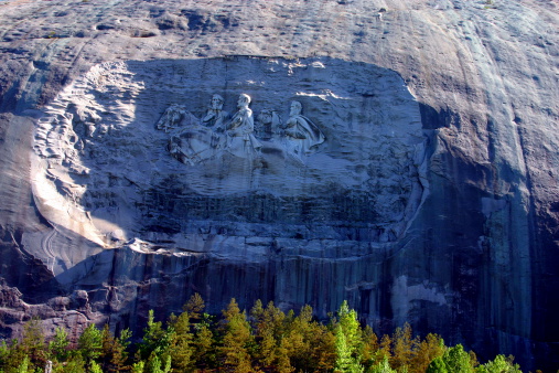 A beautiful view of stone mountain with trees as the surrounding.