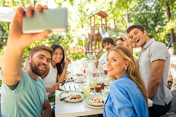 istock Friends making selfie photo in outdoor restaurant 487532132