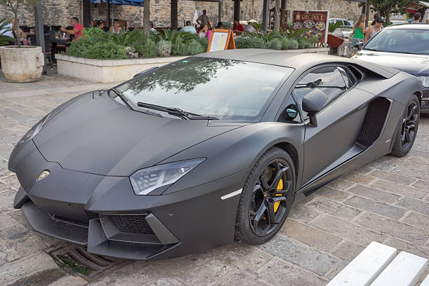 Moscow, Russia - July 9, 2011: Green supercar Lamborghini Murcielago drives at the city street.