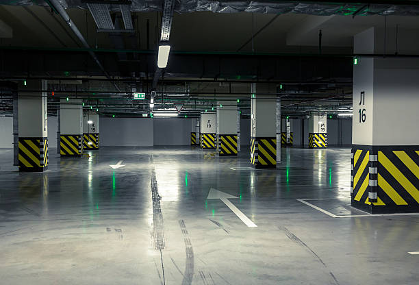istock Parking garage, underground interior with a few parked cars 487532558
