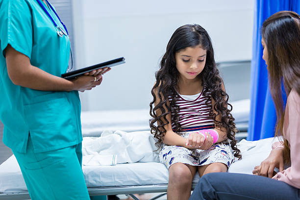 istock Pediatric patient in emergency room with injured arm 487532966