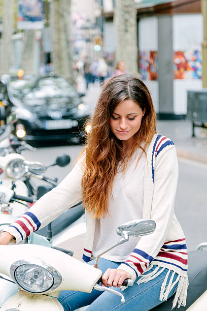 istock Beautiful woman on moped, Barcelona 487534369