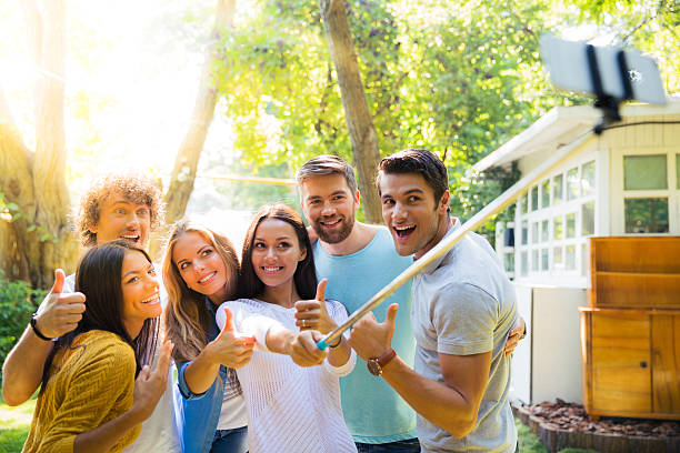 istock Friends making selfie photo outdoors 487535120