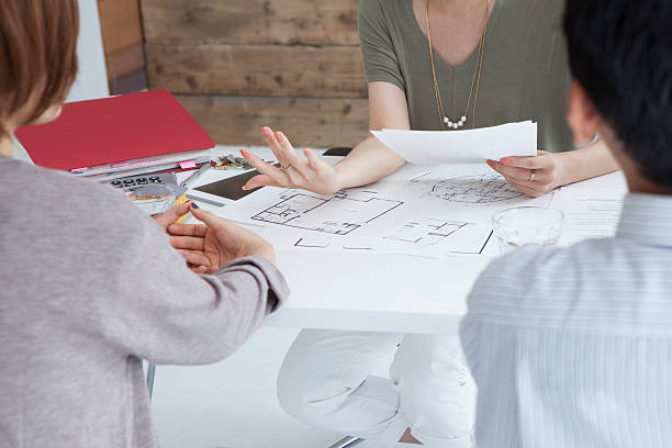 istock Real Estate Agent that eagerly explaining to a couple 487535418