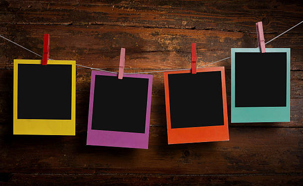 istock Instant photographs on a clothesline 487535646