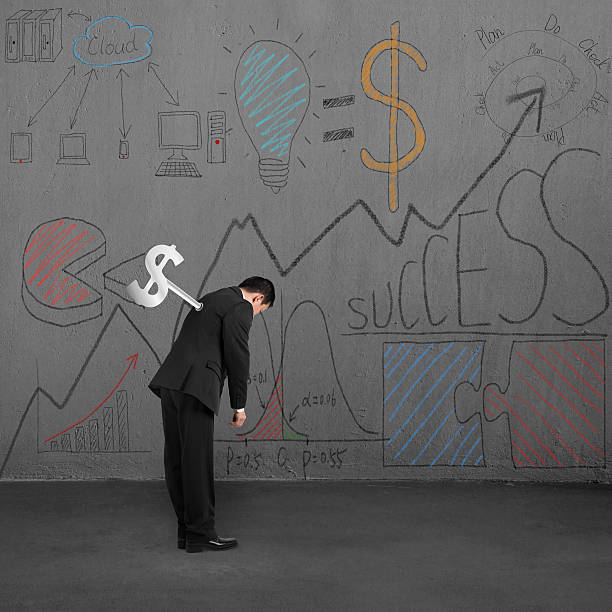 istock Man tired with winder and business doodles on wall 487536615