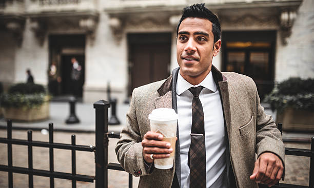 istock Pensive businessman drinking a mug of coffee 487536889