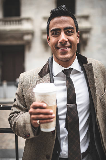 istock Pensive businessman drinking a mug of coffee 487536897