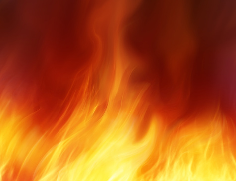 Close-up of flames against black background.