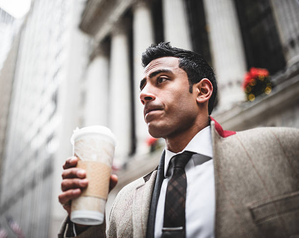 istock Pensive businessman drinking a mug of coffee 487536935