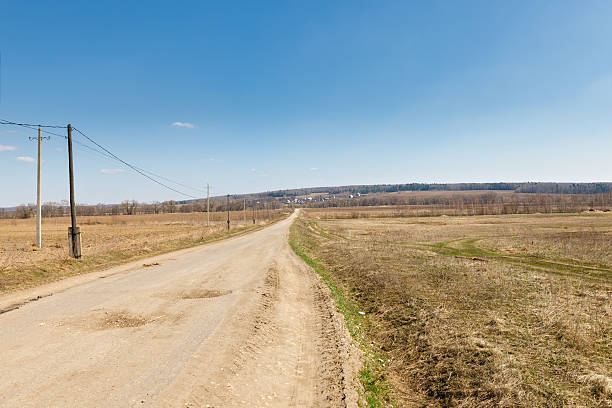 istock road leading to the village 487537007