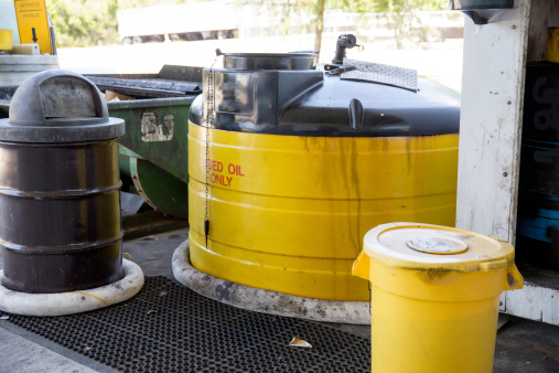 Containers at a recycle center are designated for used oil.  RM