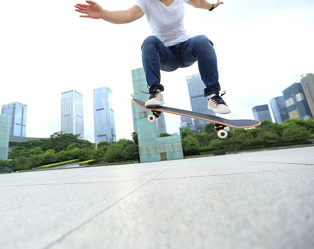 istock skateboarder skateboarding at city 487537520